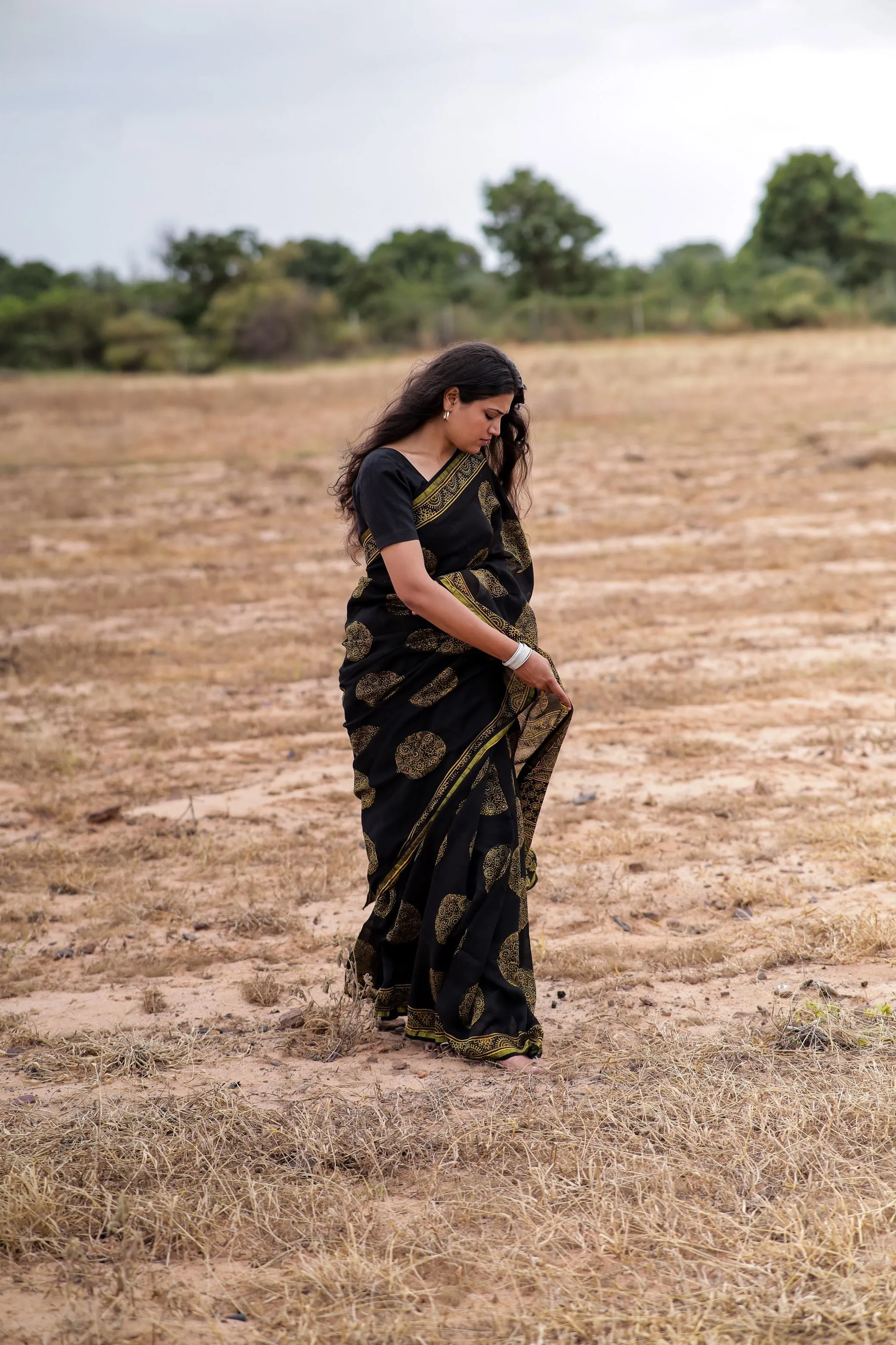 Jharokha -Black and green floral silk cotton Ajrakh handblockprinted saree